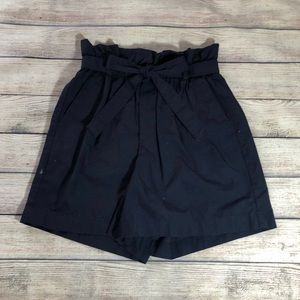 Navy paper bag high waisted shorts.